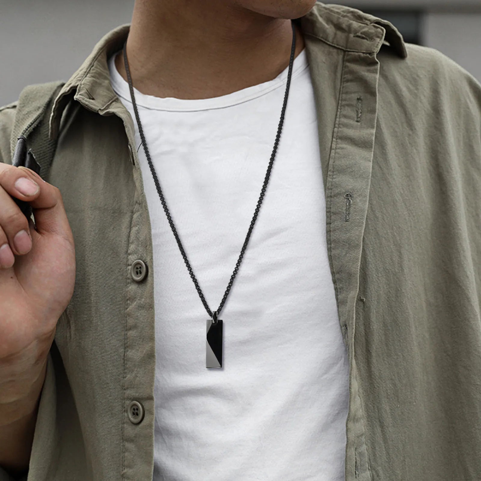 "Geometrix" - unisex stainless steel necklace black display on man
